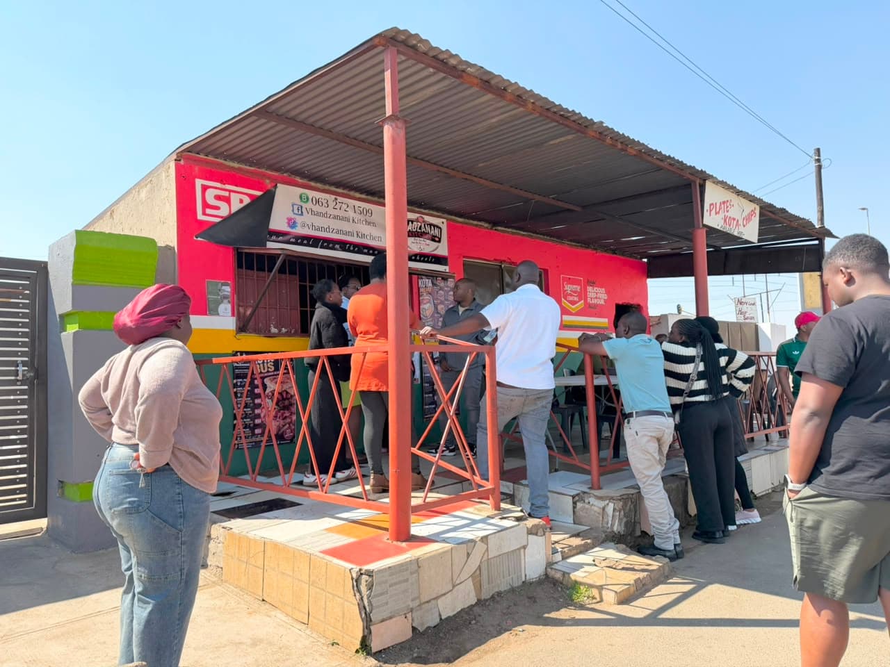 Customers gathered outside Vhadzanani Kitchen