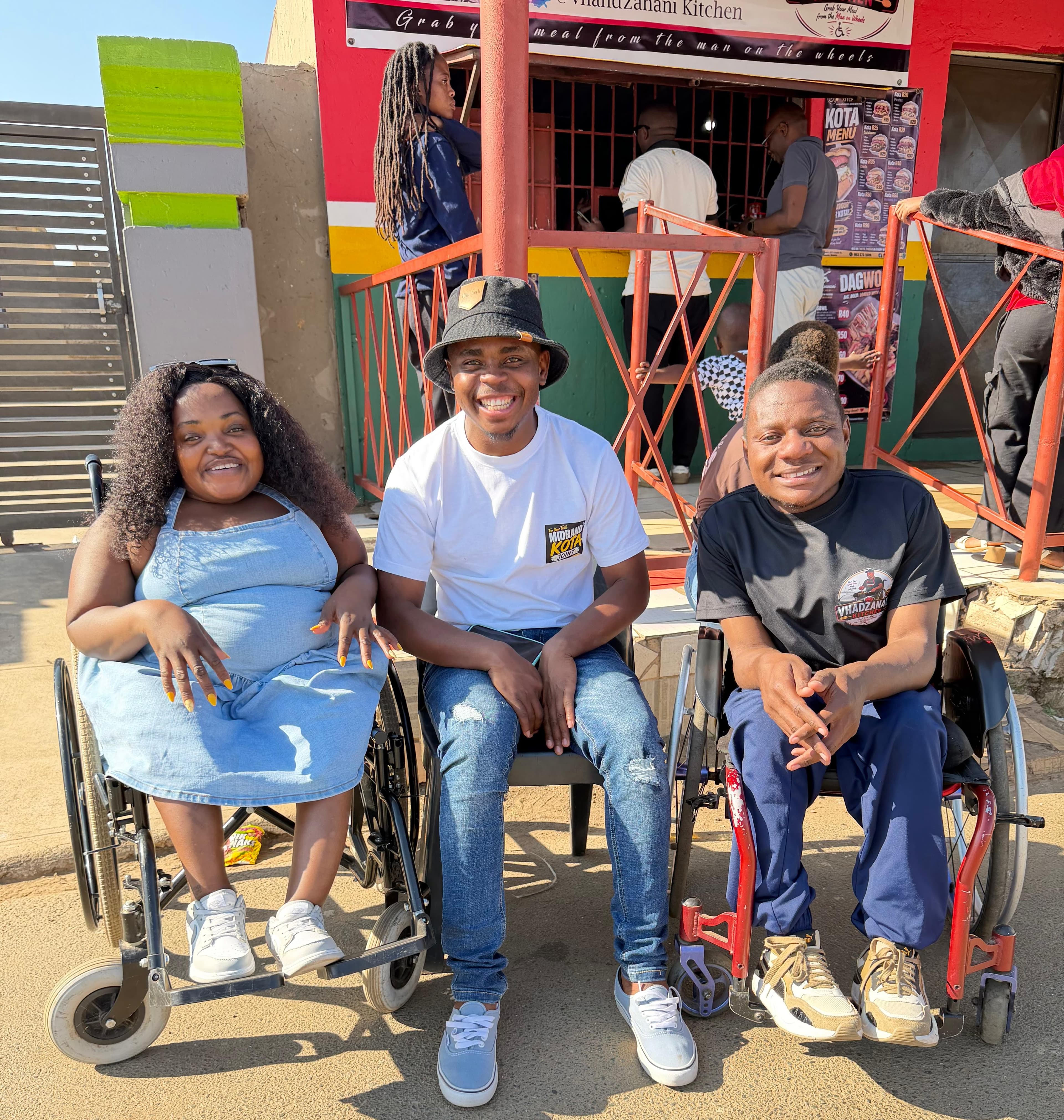 Ronewa Mudzanani with members of the community outside Vhadzanani Kitchen