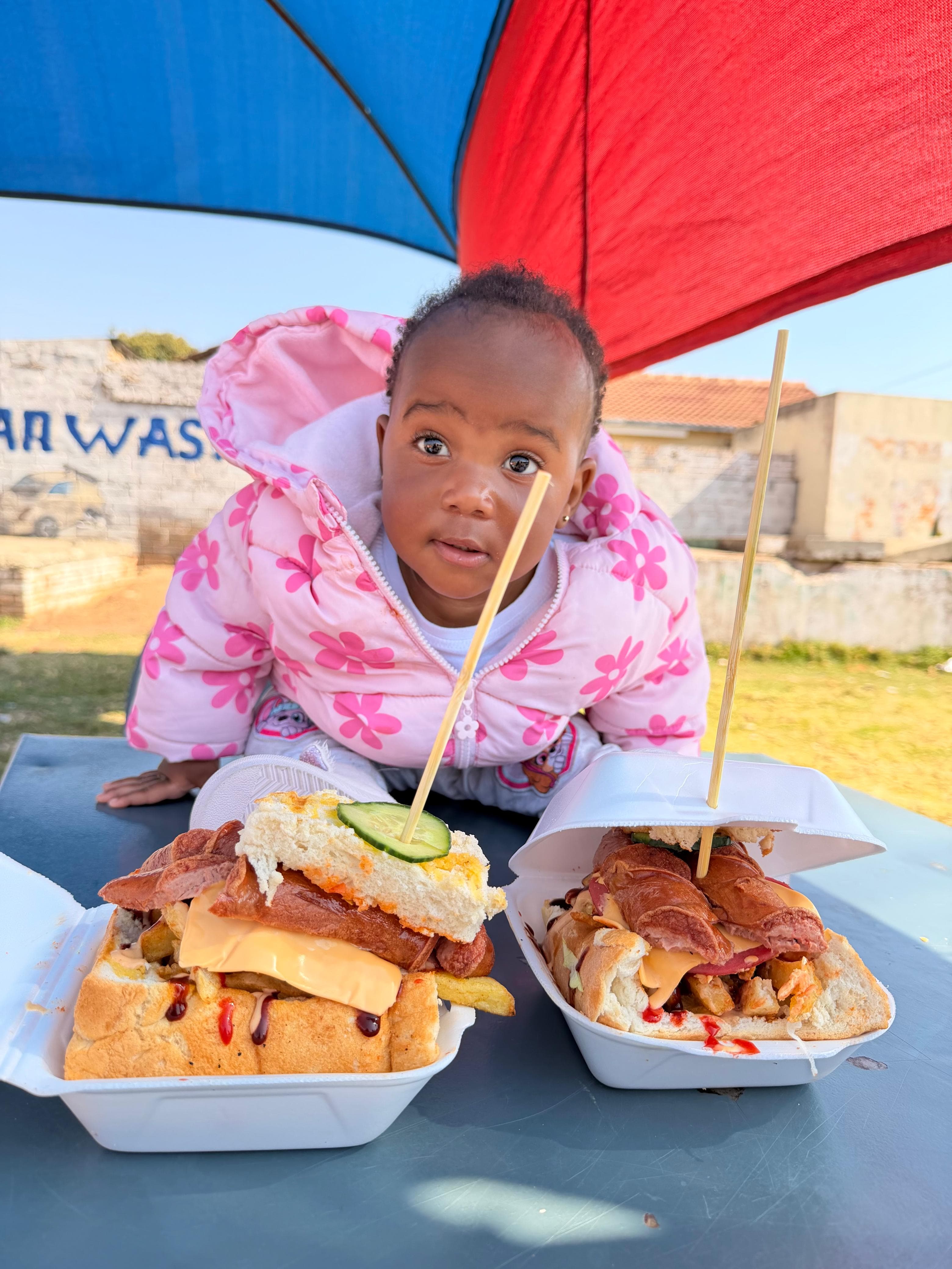 Young customer with food at Vhadzanani Kitchen