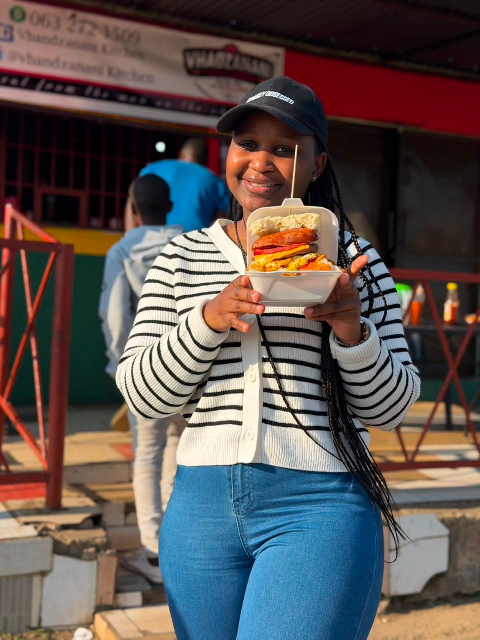 Customer proudly holding a kota