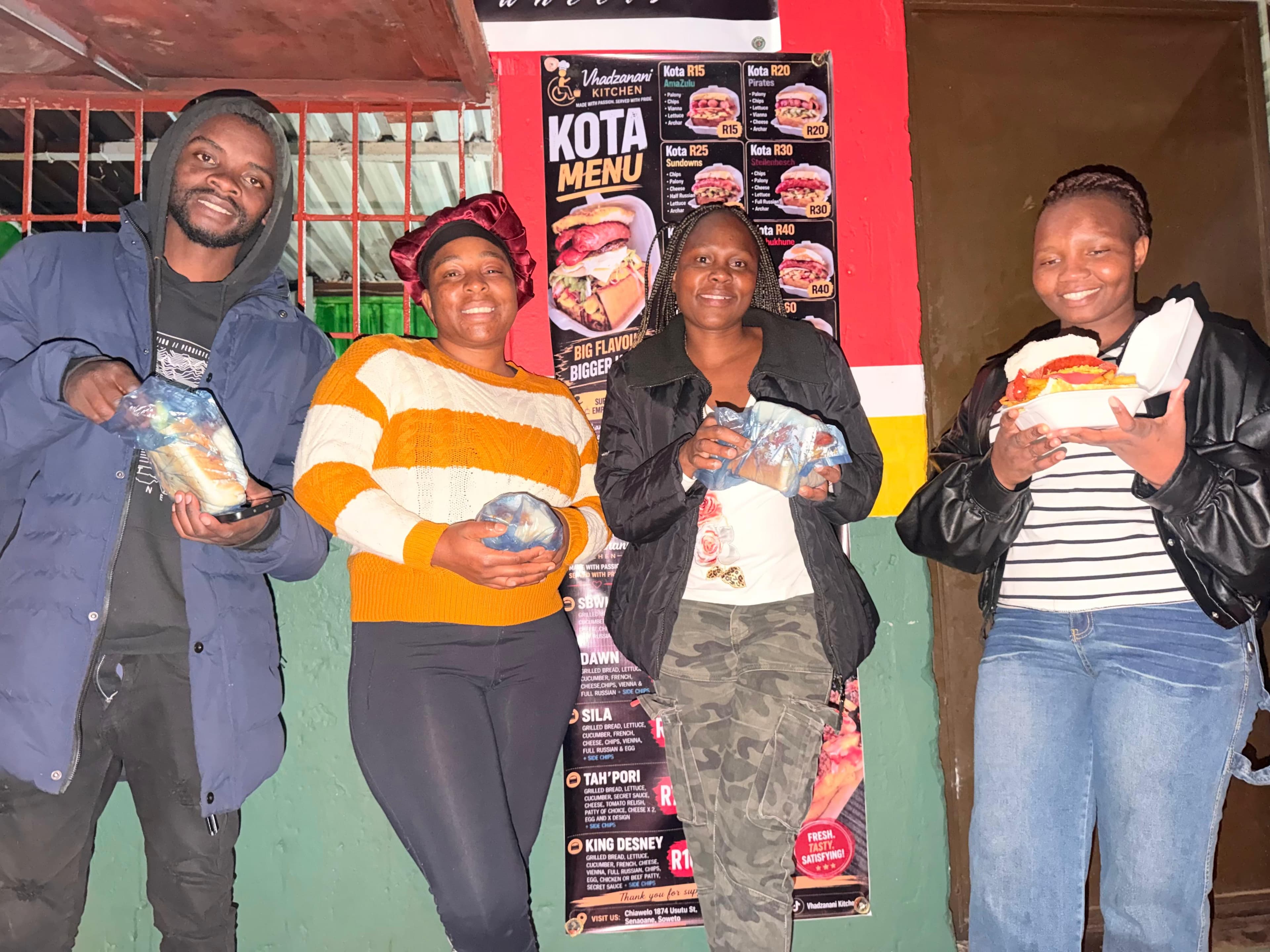 Customers collecting food at Vhadzanani Kitchen