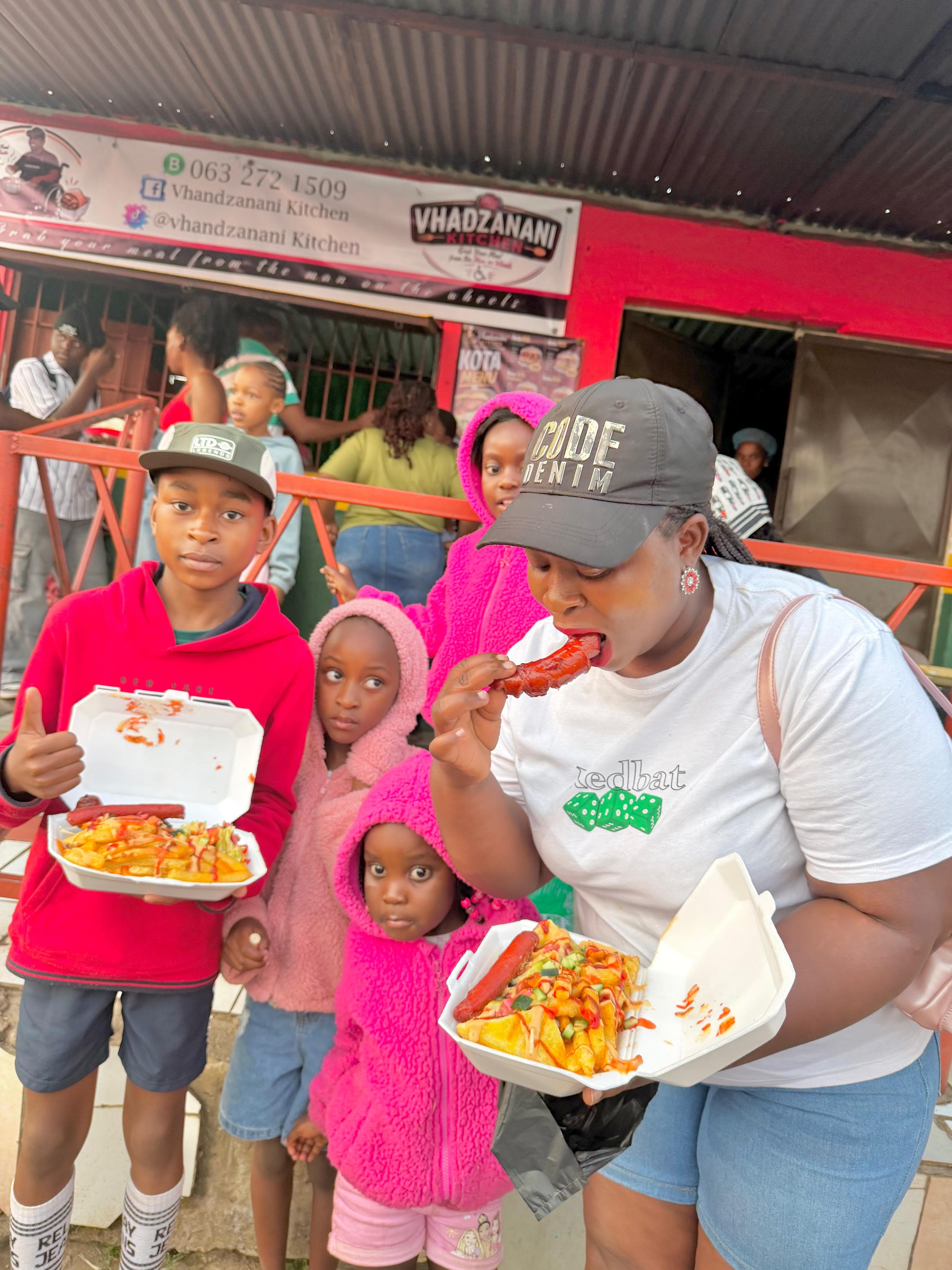 Young customers enjoying food together at Vhadzanani Kitchen