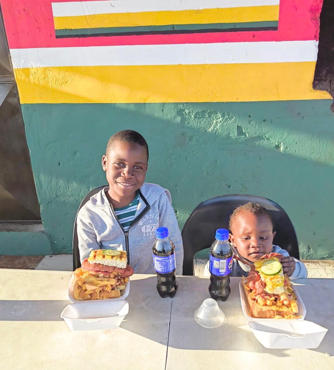 Young customers enjoying Vhadzanani Kitchen